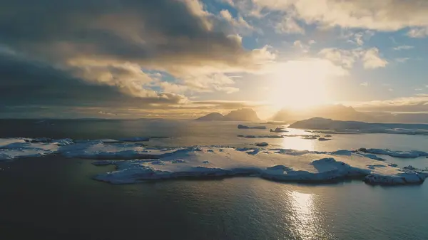 stock image Sunset Above Antarctica Snow Island Aerial Front View. Antarctic Winter Ocean Water. Beautiful Sky Horizon Landscape Drone Takeoff Flight