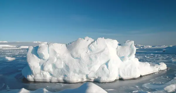 stock image A massive block of ice in frozen ocean surface. Arctic environment preserve of ice. A breathtaking scene of Antarctic glacier. Natural beauty towering glacier. Ice float polar ocean. Aerial panorama