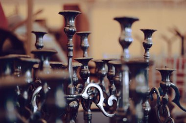 Selective focus or bokeh concept photo of a scene with empty candlesticks