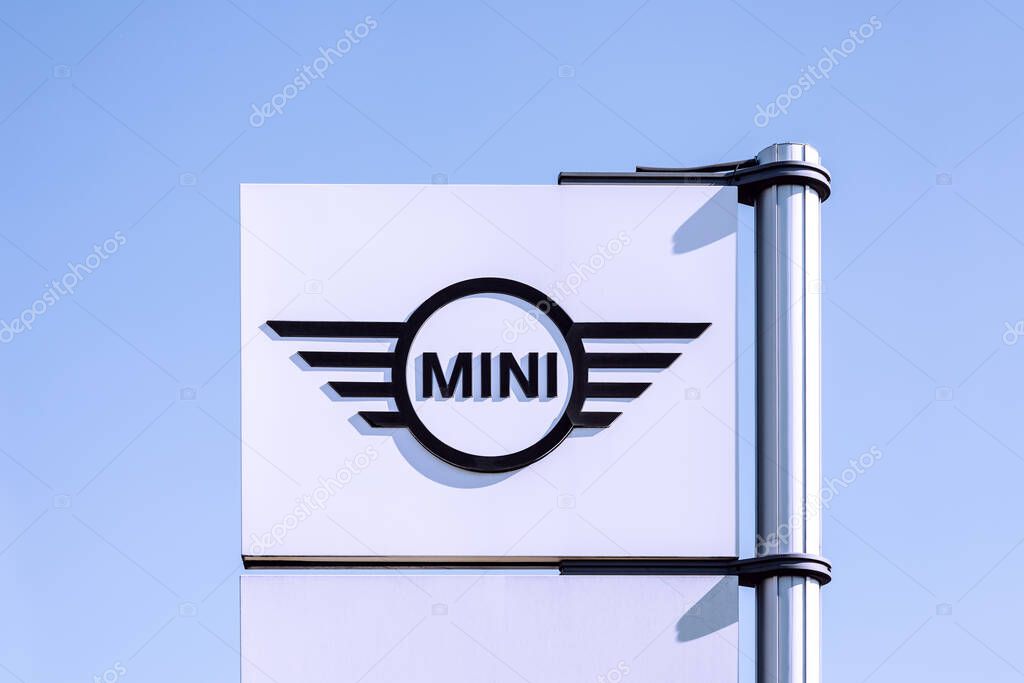 Poznan, Poland - March 28, 2025: MINI cars logo on a pylon, Mini is a British automotive brand founded in Oxford in 1969, since 2000 owned by the BMW Group.