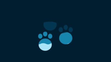 White Paw print icon isolated on blue background. Dog or cat paw print. Animal track. 4K Video motion graphic animation.