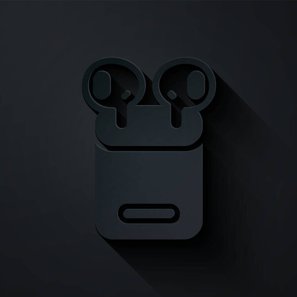 Paper cut Air headphones in box icon isolated on black background. Holder wireless in case earphones garniture electronic gadget. Paper art style. Vector.