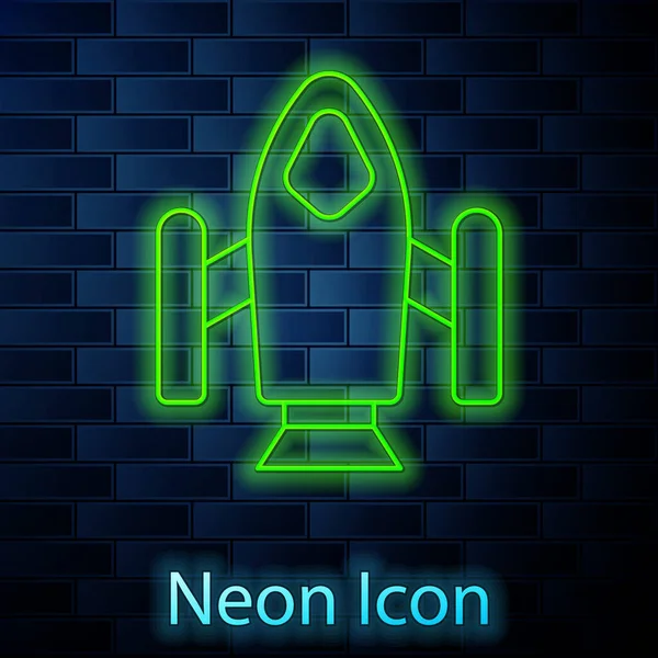 Glowing Neon Line Rocket Ship Icon Isolated Brick Wall Background — Stock Vector