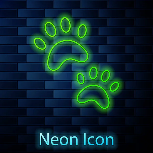 Glowing Neon Line Paw Print Icon Isolated Brick Wall Background — Stock Vector
