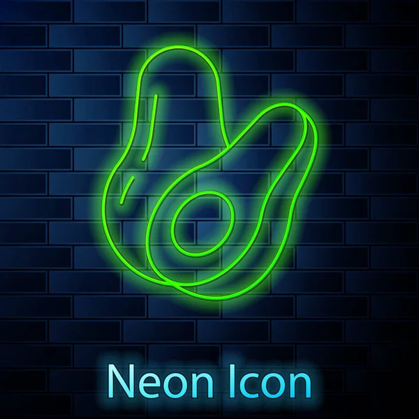 Zářící Neonová Čára Ikona Ovoce Avokádo Izolované Pozadí Cihlové Zdi — Stockový vektor