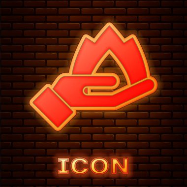Parlayan neon el, tuğla duvar arkasında izole edilmiş bir ateş ikonu tutuyor. Sigorta konsepti. Güvenlik, güvenlik, koruma, konsept koruma. Vektör..