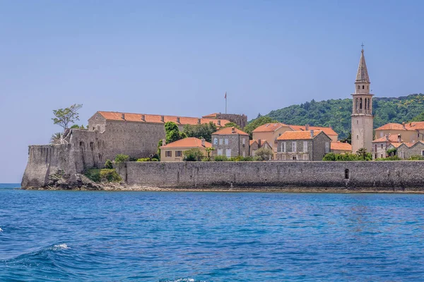 View on the Old Town and tower of John the Baptist cathedral in Budva, Montenegro