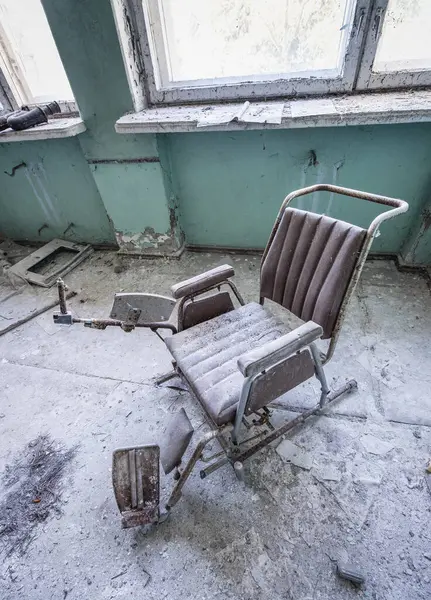 Examination chair in Hospital MsCh-126 in Pripyat ghost city in Chernobyl Exclusion Zone, Ukraine