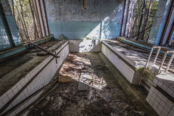 Small pool in Azure Swimming Pool in Pripyat ghost city in Chernobyl Exclusion Zone, Ukraine
