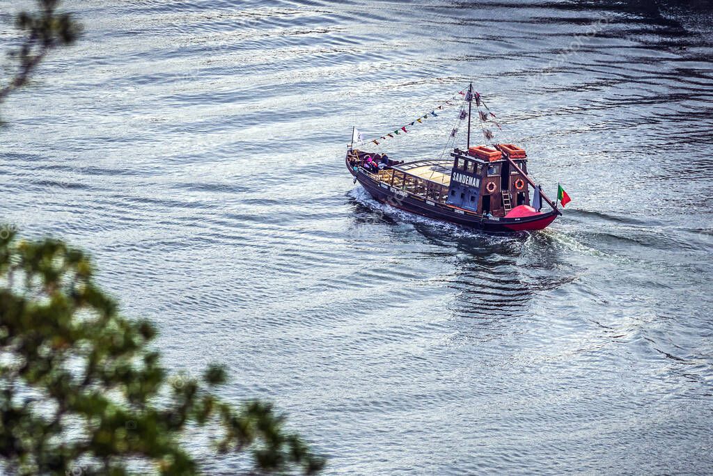 Porto, Portugal - December 8, 2016: Sandeman tourist boat on a Douro River in Porto