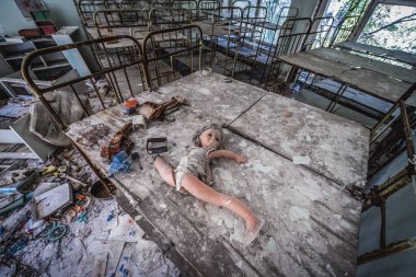 Pripyat, Ukraine - October 2, 2014: Bunk beds in Kindergarten No. 10 Cheburashka in Pripyat ghost city in Chernobyl Exclusion Zone clipart