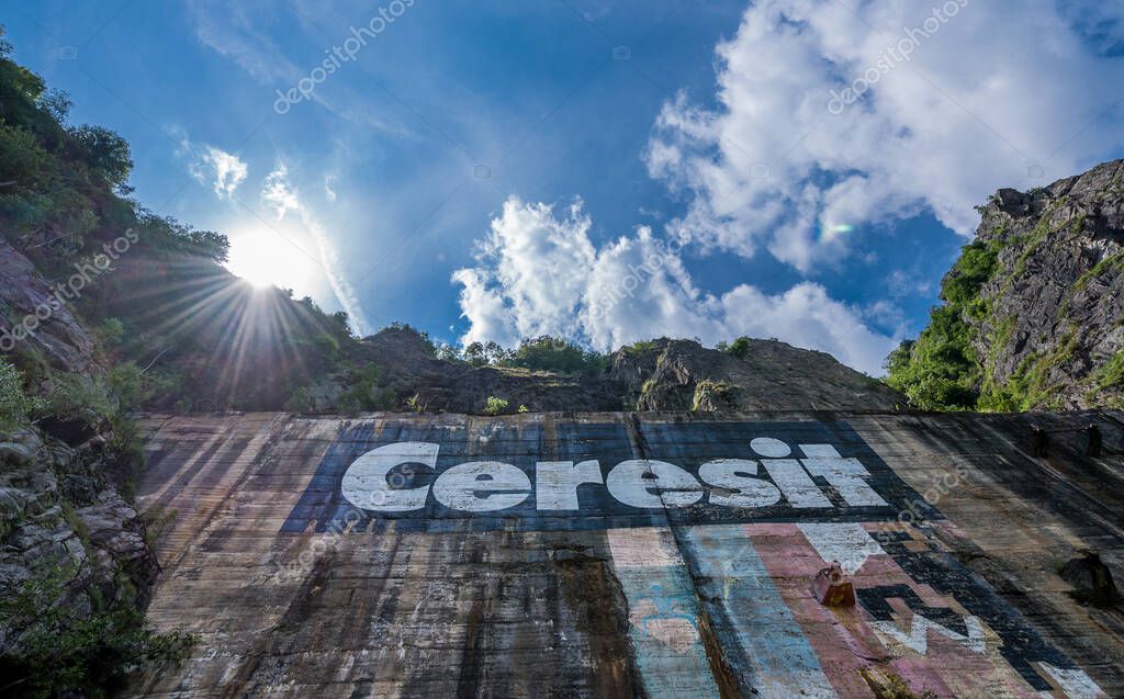 Arges County, Romania - July 6, 2016: Ceresit logo on construction of Vidraru Dam on the Arges River