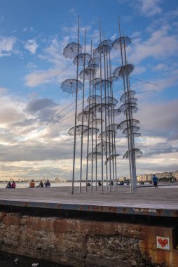 Thessaloniki, Greece - October 11, 2021: The Umbrellas sculpture by George Zongolopoulos in Thessaloniki city, Greece clipart