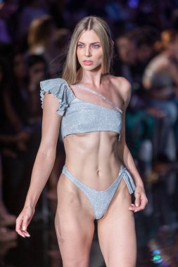 A model walks the runway for Cirone Swimwear Fashion Show during Art, Hearts, Fashion Swim Week at the Faena Forum in Miami Beach on 7- 11- 2021