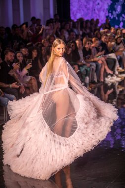 A model walks the runway for Cirone Swimwear Fashion Show during Art, Hearts, Fashion Swim Week at the Faena Forum in Miami Beach on 7- 11- 2021