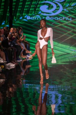 A model walks the runway for Berry Beachy Swimwear  Papi Swim Fashion Show during Art, Hearts, Fashion Swim Week at the Faena Forum in Miami Beach on 7- 11- 2021
