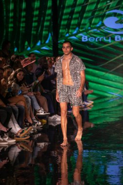 A model walks the runway for Berry Beachy Swimwear  Papi Swim Fashion Show during Art, Hearts, Fashion Swim Week at the Faena Forum in Miami Beach on 7- 11- 2021