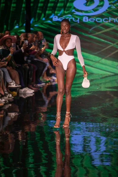 A model walks the runway for Berry Beachy Swimwear  Papi Swim Fashion Show during Art, Hearts, Fashion Swim Week at the Faena Forum in Miami Beach on 7- 11- 2021