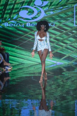 A model walks the runway for Berry Beachy Swimwear Papi Swim Fashion Show during Art, Hearts, Fashion Swim Week at the Faena Forum in Miami Beach on 7- 11- 2021