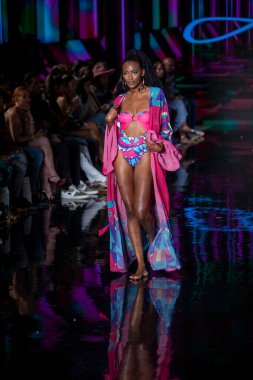 A model walks the runway for Aude Fashion Show during Art, Hearts, Fashion Swim Week at the Faena Forum in Miami Beach on 7- 11- 2021