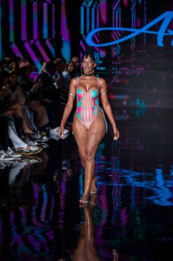 A model walks the runway for Aude Fashion Show during Art, Hearts, Fashion Swim Week at the Faena Forum in Miami Beach on 7- 11- 2021