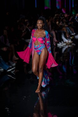 A model walks the runway for Aude Fashion Show during Art, Hearts, Fashion Swim Week at the Faena Forum in Miami Beach on 7- 11- 2021