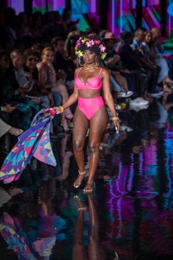 A model walks the runway for Aude Fashion Show during Art, Hearts, Fashion Swim Week at the Faena Forum in Miami Beach on 7- 11- 2021