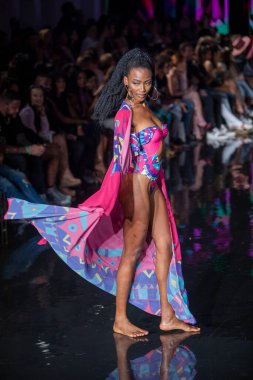 A model walks the runway for Aude Fashion Show during Art, Hearts, Fashion Swim Week at the Faena Forum in Miami Beach on 7- 11- 2021
