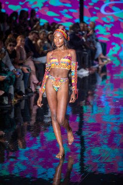 A model walks the runway for Aude Fashion Show during Art, Hearts, Fashion Swim Week at the Faena Forum in Miami Beach on 7- 11- 2021