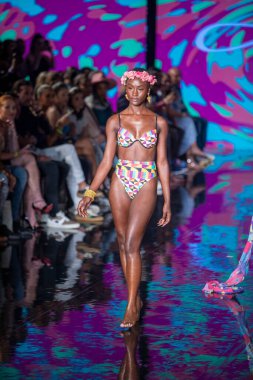 A model walks the runway for Aude Fashion Show during Art, Hearts, Fashion Swim Week at the Faena Forum in Miami Beach on 7- 11- 2021