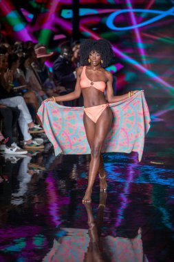 A model walks the runway for Aude Fashion Show during Art, Hearts, Fashion Swim Week at the Faena Forum in Miami Beach on 7- 11- 2021