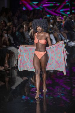 A model walks the runway for Aude Fashion Show during Art, Hearts, Fashion Swim Week at the Faena Forum in Miami Beach on 7- 11- 2021