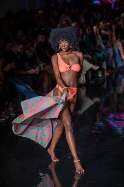 A model walks the runway for Aude Fashion Show during Art, Hearts, Fashion Swim Week at the Faena Forum in Miami Beach on 7- 11- 2021