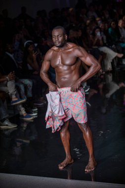 A model walks the runway for Aude Fashion Show during Art, Hearts, Fashion Swim Week at the Faena Forum in Miami Beach on 7- 11- 2021