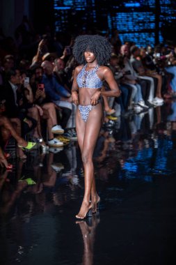 A model walks the runway for Bikini Beach Australia Fashion Show during Art, Hearts, Fashion Swim Week at the Faena Forum in Miami Beach on 7- 11- 2021