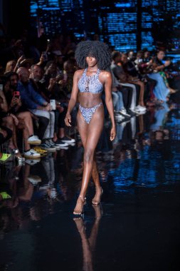 A model walks the runway for Bikini Beach Australia Fashion Show during Art, Hearts, Fashion Swim Week at the Faena Forum in Miami Beach on 7- 11- 2021