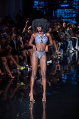A model walks the runway for Bikini Beach Australia Fashion Show during Art, Hearts, Fashion Swim Week at the Faena Forum in Miami Beach on 7- 11- 2021