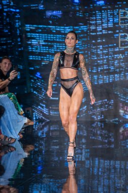 A model walks the runway for Bikini Beach Australia Fashion Show during Art, Hearts, Fashion Swim Week at the Faena Forum in Miami Beach on 7- 11- 2021