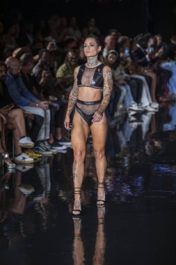 A model walks the runway for Bikini Beach Australia Fashion Show during Art, Hearts, Fashion Swim Week at the Faena Forum in Miami Beach on 7- 11- 2021