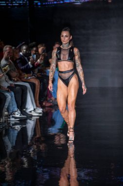 A model walks the runway for Bikini Beach Australia Fashion Show during Art, Hearts, Fashion Swim Week at the Faena Forum in Miami Beach on 7- 11- 2021