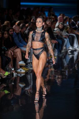 A model walks the runway for Bikini Beach Australia Fashion Show during Art, Hearts, Fashion Swim Week at the Faena Forum in Miami Beach on 7- 11- 2021