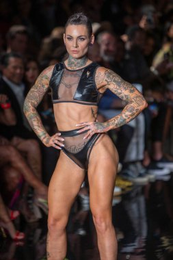 A model walks the runway for Bikini Beach Australia Fashion Show during Art, Hearts, Fashion Swim Week at the Faena Forum in Miami Beach on 7- 11- 2021