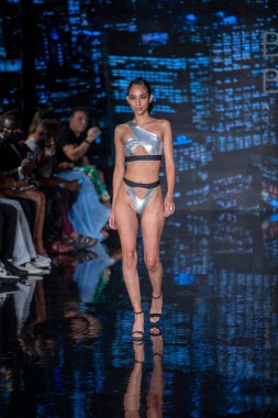 A model walks the runway for Bikini Beach Australia Fashion Show during Art, Hearts, Fashion Swim Week at the Faena Forum in Miami Beach on 7- 11- 2021
