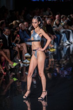 A model walks the runway for Bikini Beach Australia Fashion Show during Art, Hearts, Fashion Swim Week at the Faena Forum in Miami Beach on 7- 11- 2021