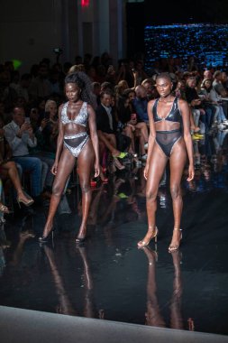 A model walks the runway for Bikini Beach Australia Fashion Show during Art, Hearts, Fashion Swim Week at the Faena Forum in Miami Beach on 7- 11- 2021