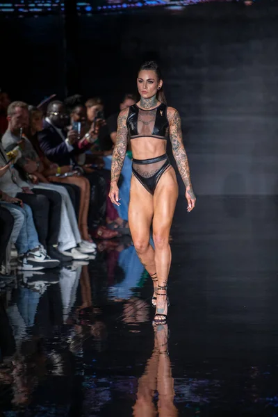 A model walks the runway for Bikini Beach Australia Fashion Show during Art, Hearts, Fashion Swim Week at the Faena Forum in Miami Beach on 7- 11- 2021