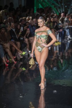 A model walks the runway for Bikini Beach Australia Fashion Show during Art, Hearts, Fashion Swim Week at the Faena Forum in Miami Beach on 7- 11- 2021