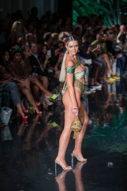A model walks the runway for Bikini Beach Australia Fashion Show during Art, Hearts, Fashion Swim Week at the Faena Forum in Miami Beach on 7- 11- 2021