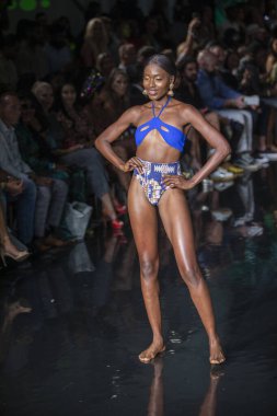 A model walks the runway for Bikini Beach Australia Fashion Show during Art, Hearts, Fashion Swim Week at the Faena Forum in Miami Beach on 7- 11- 2021