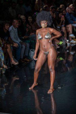 A model walks the runway for Bikini Beach Australia Fashion Show during Art, Hearts, Fashion Swim Week at the Faena Forum in Miami Beach on 7- 11- 2021
